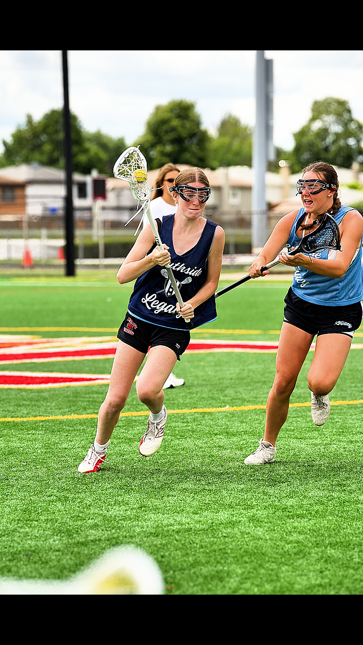 Southside Legacy player carrying the ball on turf