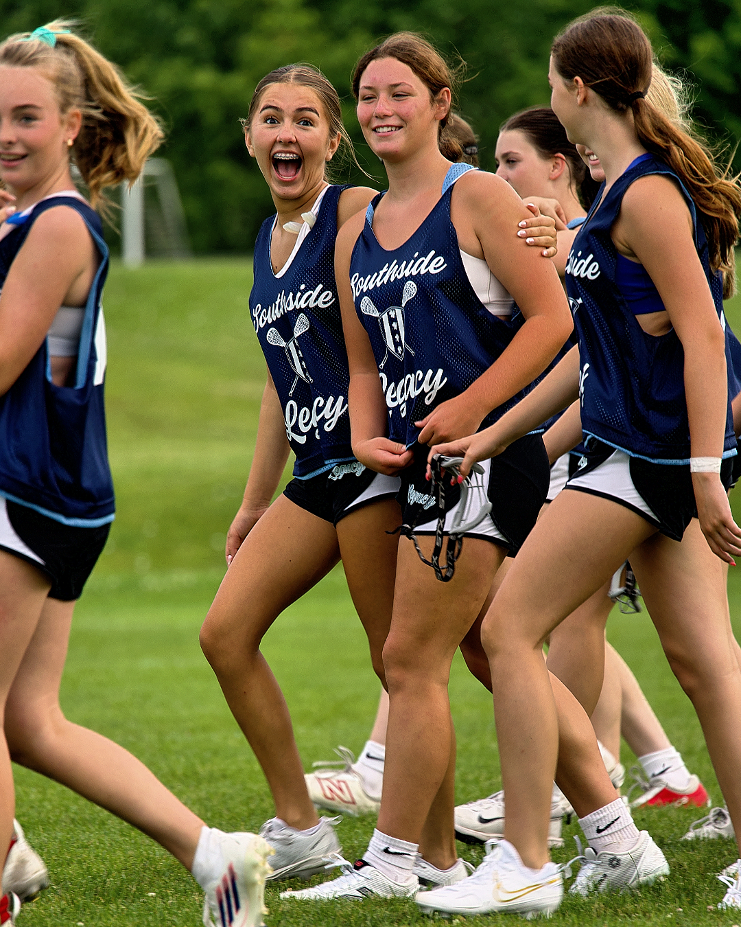 Southside Legacy athletes smiling on the field